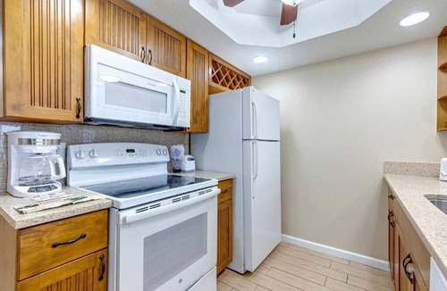 Cocoa Isles Apartment | Beachfront 2BR Retreat | Balcony + Full Kitchen