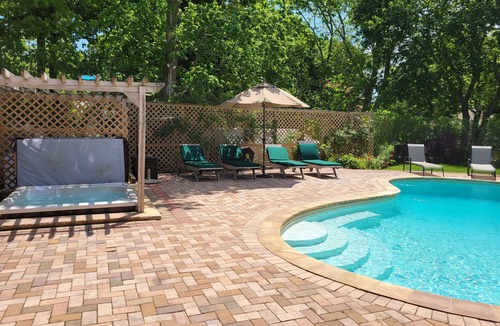 Hampton Bays House | Charming Split-Level House with heated pool, hot tub & a brand-new septic system