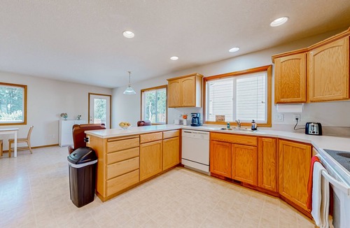 Gresham House | Custom-built home alongside greenspace with deck & massage chairs