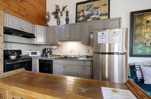 Kings Beach Condo | Eclectic second floor condo with loft, balcony, & gas fireplace - family friendly