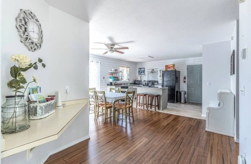 Woods Bay House | Mountain-view home with large deck, gas grill, firepit, lawn, and central AC
