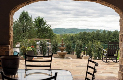Wernersville House | Overlook Retreat Manor is a luxury private estate on 100 scenic acres for up to 24 guests. Enjoy the pool, hot tub, game room, sports court, and breathtaking sunset views. The kind of place people talk about long after they leave.