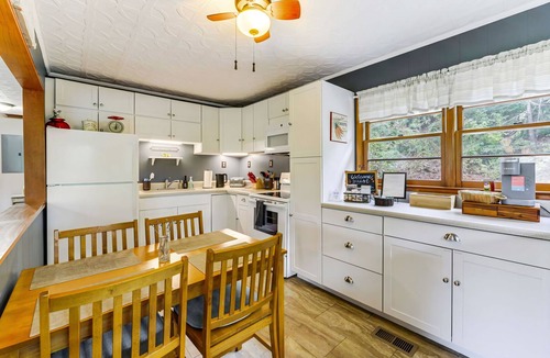 Sylva Cottage | Pet Friendly Riverfront Home near WCU! Trout fishing near Cullowhee & Smoky Mtns