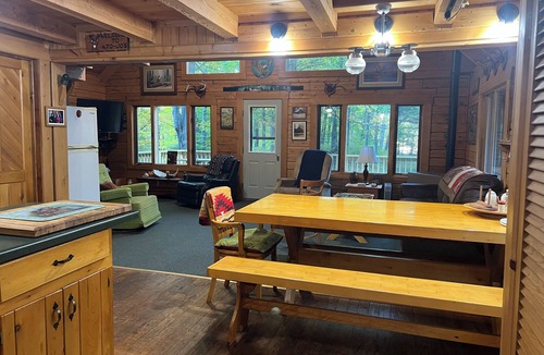 Crystal Falls Cabin | Rustic Forest Getaway has the comforts of home surrounded by woods and water.