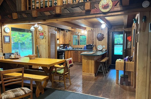 Crystal Falls Cabin | Rustic Forest Getaway has the comforts of home surrounded by woods and water.