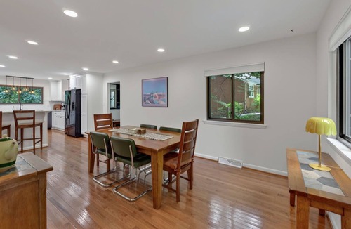 Charlottesville House | Settle into this stylish 4 bedroom, 3.5 bath midterm rental, thoughtfully designed with a warm midcentury modern vibe. Enjoy two primary suites, generous storage, a spacious deck, covered porch and private wooded backyard.