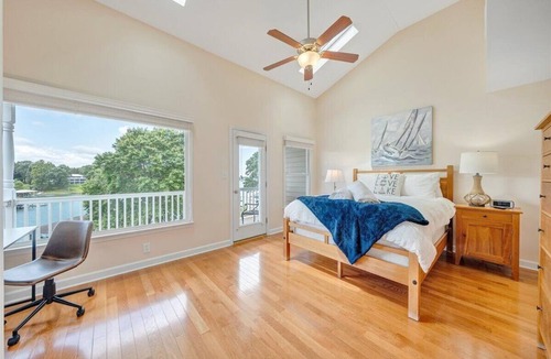 Huddleston House | The full Smith Mountain Lakefront experience: private boat slip, 3 balconies, game room, community pool & beach, propane grill, and pets welcome. No resort fees, ever.