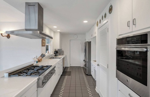 Water Mill House | Traditional-style home with private pool, sweeping back deck, grand lawn,.