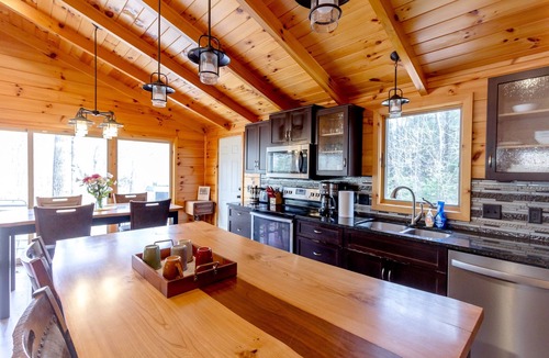 Evart House | Two Riverfront Homes | Hot Tub, Sauna, Kayaks + More
