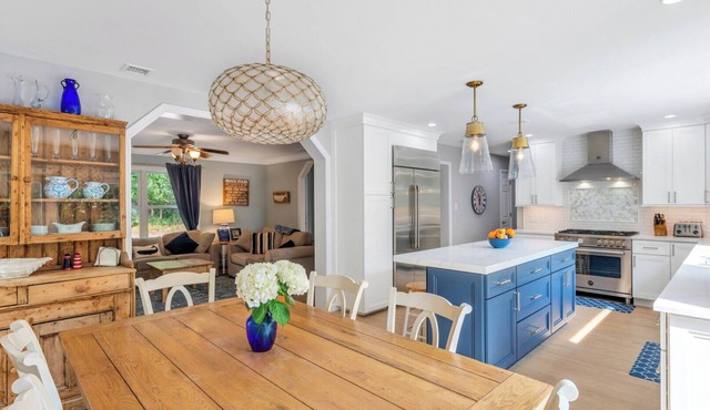 Coastal-style home with open-floor plan, ample natural light, blocks away.