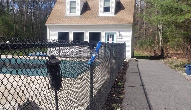 Cottage sitting behind the main house on approximately 2 acres of property.