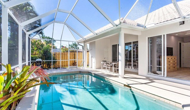 Imola Vacation Rental - Remodeled Pool Home Minutes from Vanderbilt Beach! Family-Friendly Retreat with 4 BR 4 BA and Private Screened Pool!