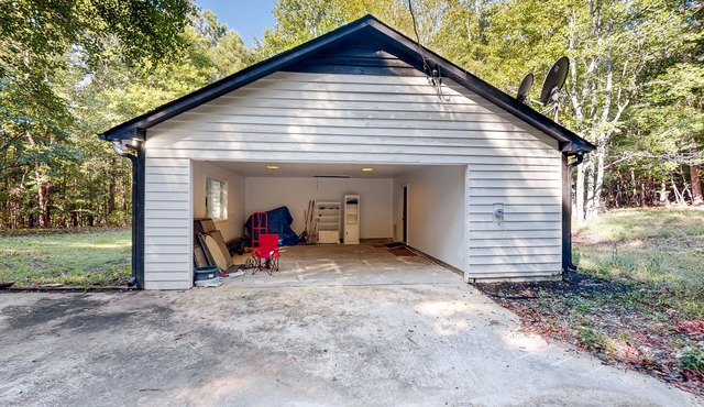 Secluded dog-friendly cabin with updated interior, firepit, games, W/D, and AC
