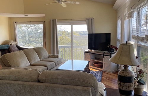 Charleston Apartment | Folly Beach Riverfront Apt with dock, private boat ramp kayaks and bikes